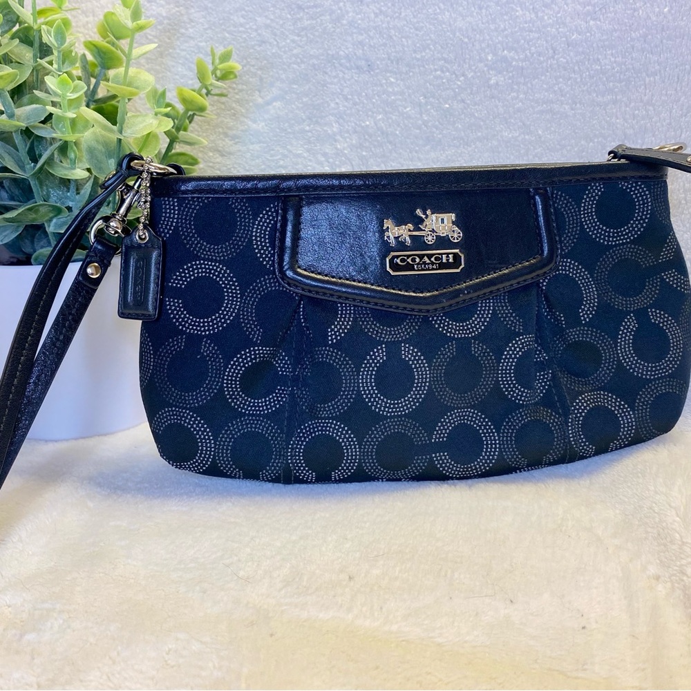 Black and silver Coach Clutch. Inside lining is royal blue.